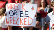 Texas Tech fans wave signs.