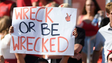 Texas Tech fans wave signs.