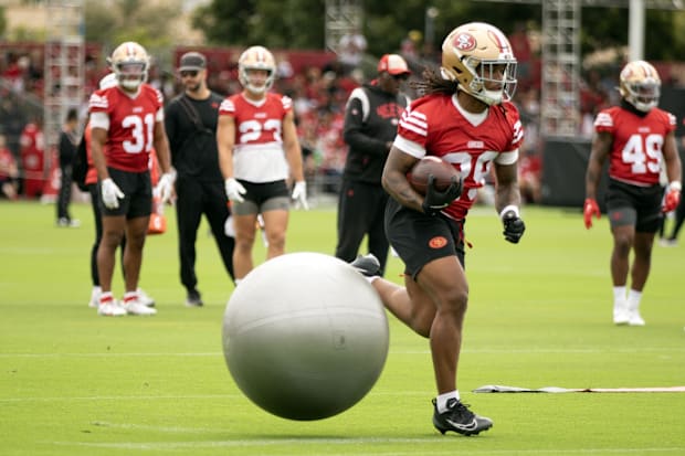 San Francisco 49ers running back Jordan James (29) runs through an obstacle course during the second day of training camp. San Francisco 49ers running back Jordan James (29) runs through an obstacle course during the second day of training camp.
