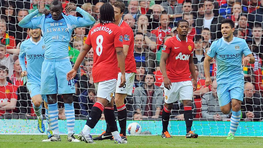 Mario Balotelli celebrating scoring for Man City at rivals Man Utd. 