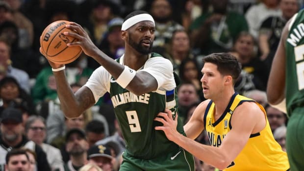 Milwaukee Bucks forward Bobby Portis looks for a shot against Indiana Pacers forward Doug McDermott in the 2024 NBA playoffs.