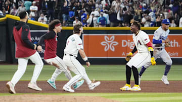 Arizona Diamondbacks Geraldo Perdomo (2) celebrates after hitting the game winning RBI-single to defeat the Los Angeles Dodgers 5-4 in the ninth inning at Chase Field in Phoenix on Sept. 23, 2025. Mandatory Credit: Rob Schumacher-Arizona Republic