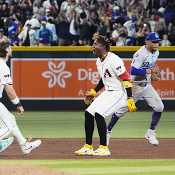 Arizona Diamondbacks Geraldo Perdomo (2) celebrates after hitting the game winning RBI-single to defeat the Los Angeles Dodgers 5-4 in the ninth inning at Chase Field in Phoenix on Sept. 23, 2025. Mandatory Credit: Rob Schumacher-Arizona Republic