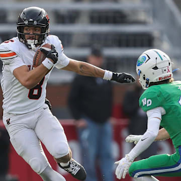West De Pere High School's Judeah Kniskern (8) jukes past Notre Dame Academy's Jonah Marzec (11) during the WIAA Division 2 state championship football game on Friday, November 21, 2025, at Camp Randall Stadium in Madison, Wis. Tork Mason/USA TODAY NETWORK-Wisconsin