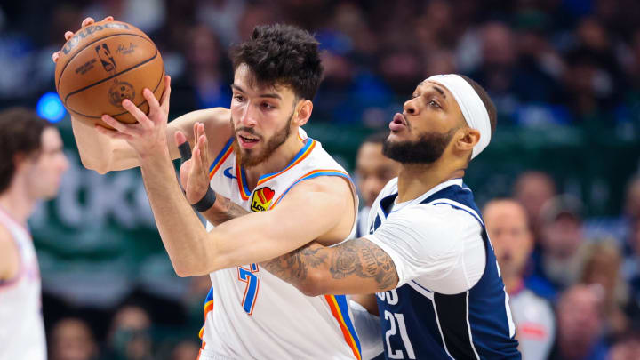 May 11, 2024; Dallas, Texas, USA; Oklahoma City Thunder forward Chet Holmgren (7) controls the ball as Dallas Mavericks center Daniel Gafford (21) defends during the first quarter during game three of the second round for the 2024 NBA playoffs at American Airlines Center. Mandatory Credit: Kevin Jairaj-USA TODAY Sports