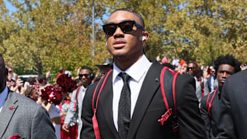 Sep 14, 2024; Fayetteville, Arkansas, USA; Arkansas Razorbacks quarterback Taylen Green (center) and defensive end Landon Jackson (right) during the Hog Walk prior to the game against the UAB Blazers at Donald W. Reynolds Razorback Stadium. Mandatory Credit: Nelson Chenault-Imagn Images