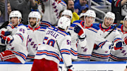 Dec 15, 2024; St. Louis, Missouri, USA;  New York Rangers left wing Will Cuylle (50) is congratulated by teammates after scoring against the St. Louis Blues during the third period at Enterprise Center. Mandatory Credit: Jeff Curry-Imagn Images