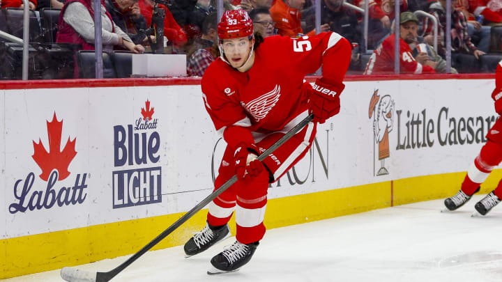 Mar 19, 2024; Detroit, Michigan, USA; Detroit Red Wings defenseman Moritz Seider (53) handles the puck during the first period of the game against the Columbus Blue Jackets at Little Caesars Arena. Mandatory Credit: Brian Bradshaw Sevald-USA TODAY Sports