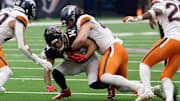 Nov 2, 2025; Houston, Texas, USA; Denver Broncos linebacker Alex Singleton (49) tackles Houston Texans wide receiver Jaylin Noel (14 during the second half at NRG Stadium. Mandatory Credit: Thomas Shea-Imagn Images
