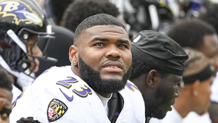 Baltimore Ravens linebacker Trenton Simpson (23) sits on the bench with teammates during the game against the Atlanta Falcons at M&T Bank Stadium. 