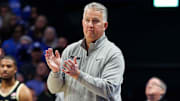 Purdue Boilermakers head coach Matt Painter claps on the sideline
