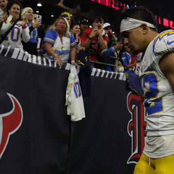 Jan 11, 2025; Houston, Texas, USA; Los Angeles Chargers safety Alohi Gilman (32) walks off after losing to Houston Texans in an AFC wild card game at NRG Stadium. Mandatory Credit: Thomas Shea-Imagn Images