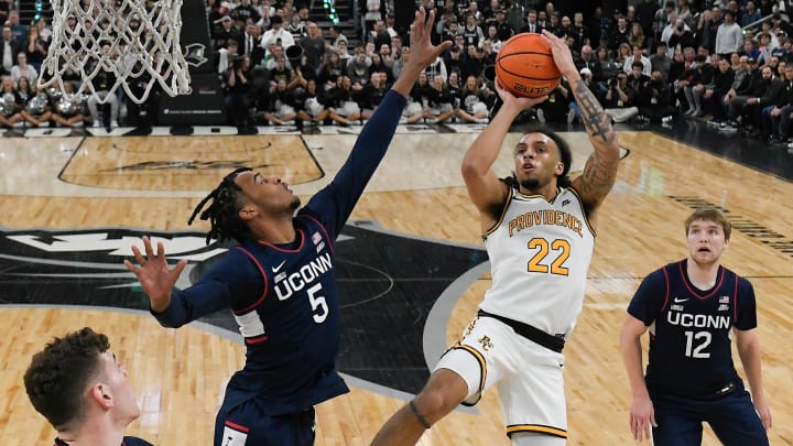 Mar 9, 2024; Providence, Rhode Island, USA; Providence Friars guard Devin Carter (22)  shoots over Connecticut Huskies guard Stephon Castle (5) during the first half at Amica Mutual Pavilion. Mandatory Credit: Eric Canha-USA TODAY Sports