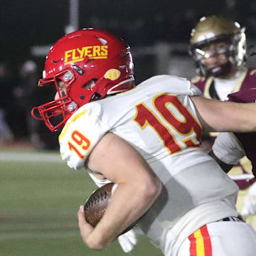 Iona Prep's Mamadee Sangaray (9) pressures Chaminade quarterback Timothy Murphy in a contest during the 2024 season. The Gaels won, 28-7.