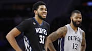 Dec 31, 2015; Auburn Hills, MI, USA; Minnesota Timberwolves center Karl-Anthony Towns (32) and Detroit Pistons forward Marcus Morris (13) share a laugh during the second quarter at The Palace of Auburn Hills. Mandatory Credit: Raj Mehta-Imagn Images