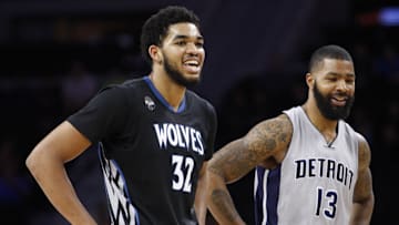 Dec 31, 2015; Auburn Hills, MI, USA; Minnesota Timberwolves center Karl-Anthony Towns (32) and Detroit Pistons forward Marcus Morris (13) share a laugh during the second quarter at The Palace of Auburn Hills. Mandatory Credit: Raj Mehta-Imagn Images