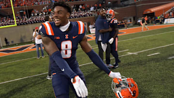 Oct 12, 2024; Champaign, Illinois, USA;  Illinois Fighting Illini defensive back Terrance Brooks (8) celebrates his team’s 50-49 overtime win over the Purdue Boilermakers at Memorial Stadium. Mandatory Credit: Ron Johnson-Imagn Images