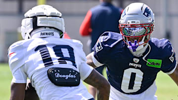 Jul 28, 2025; Foxborough, MA, USA; New England Patriots cornerback Christian Gonzalez (0) and wide receiver Kyle Williams (18) do a drill during training camp at Gillette Stadium. Mandatory Credit: Eric Canha-Imagn Images