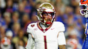Nov 29, 2025; Gainesville, Florida, USA; Florida Gators defensive end Kamran James (24) reacts after a tackle in front of Florida State Seminoles quarterback Tommy Castellanos (1) during the second half at Ben Hill Griffin Stadium. Mandatory Credit: Matt Pendleton-Imagn Images