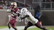 Nov 15, 2025; Tallahassee, Fla; Florida State running back Jaylin Lucas (12) is pushed out of bounds.