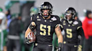 Dec 6, 2024; West Point, NY, USA; Army Black Knights linebacker Andon Thomas (51) celebrates after his interception against the Tulane Green Wave during the first half at Michie Stadium. 