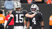 Dec 7, 2025; Paradise, Nevada, USA;  Las Vegas Raiders quarterback Kenny Pickett (15) reacts with wide receiver Shedrick Jackson (4) as the pair connected for a touchdown against the Denver Broncos during the second half at Allegiant Stadium. Mandatory Credit: Stephen R. Sylvanie-Imagn Images