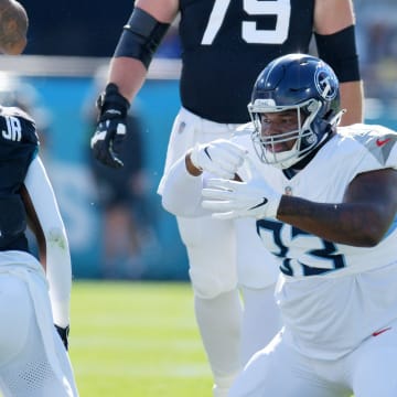 Tennessee Titans Teair Tart (93) makes an eating motion after a late first quarter tackle on Jacksonville Jaguars running back Travis Etienne Jr. (1). The Jacksonville Jaguars hosted the Tennessee Titans at EverBank Stadium in Jacksonville, FL Sunday, November 19, 2023. The Jaguars led 13 to 0 at the half. [Bob Self/Florida Times-Union]