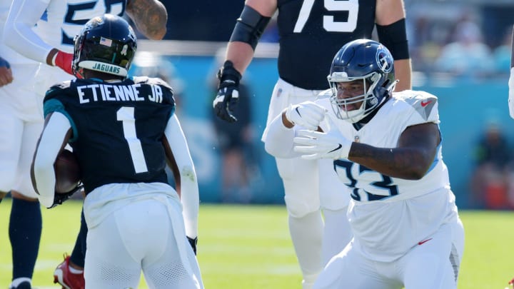 Tennessee Titans Teair Tart (93) makes an eating motion after a late first quarter tackle on Jacksonville Jaguars running back Travis Etienne Jr. (1). The Jacksonville Jaguars hosted the Tennessee Titans at EverBank Stadium in Jacksonville, FL Sunday, November 19, 2023. The Jaguars led 13 to 0 at the half. [Bob Self/Florida Times-Union]