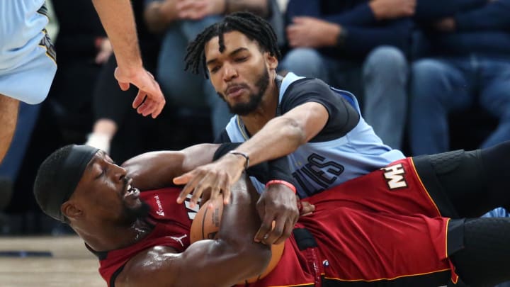 Nov 8, 2023; Memphis, Tennessee, USA; Miami Heat center Bam Adebayo (13) and Memphis Grizzlies forward Ziaire Williams (8) battle for a loose ball during the second half at FedExForum. Mandatory Credit: Petre Thomas-USA TODAY Sports