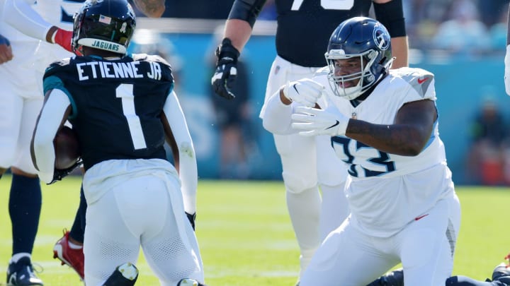 Tennessee Titans Teair Tart (93) makes an eating motion after a late first quarter tackle on Jacksonville Jaguars running back Travis Etienne Jr. (1). The Jacksonville Jaguars hosted the Tennessee Titans at EverBank Stadium in Jacksonville last season.