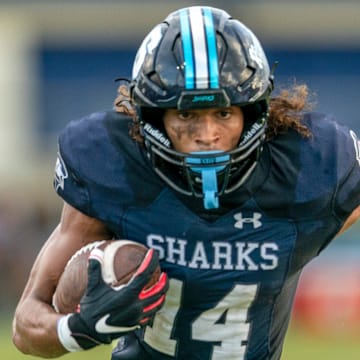 Spanish River Blake Wallace runs the ball against Seminole Ridge on August 30, 2024 in Boca Raton, Florida.