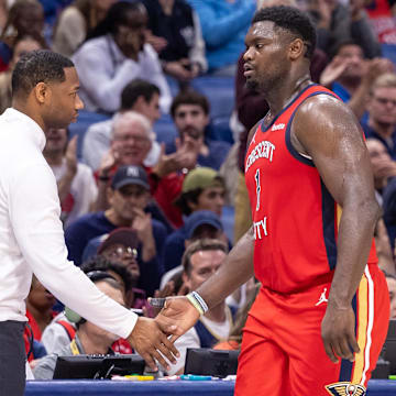 Nov 20, 2023; New Orleans, Louisiana, USA;  New Orleans Pelicans forward Zion Williamson (1) shakes hands with coach Willie Green against the Sacramento Kings during the second half at the Smoothie King Center.