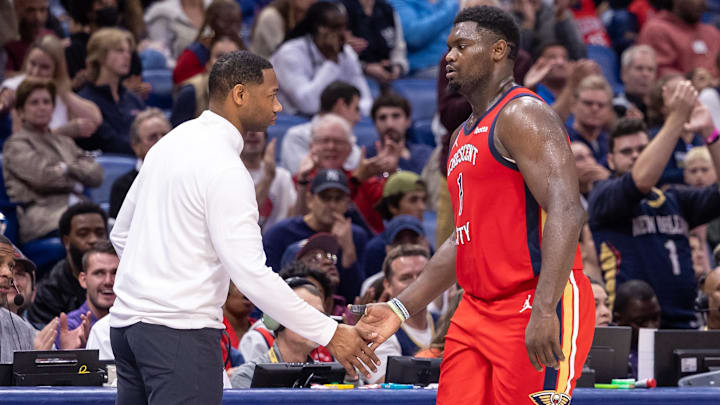 Nov 20, 2023; New Orleans, Louisiana, USA;  New Orleans Pelicans forward Zion Williamson (1) shakes hands with coach Willie Green against the Sacramento Kings during the second half at the Smoothie King Center.