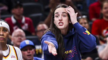 Jun 26, 2025; Indianapolis, Indiana, USA; Indiana Fever guard Caitlin Clark (22) reacts to the action against the Los Angeles Sparks during the first half at Gainbridge Fieldhouse. Mandatory Credit: Grace Smith/INDIANAPOLIS STAR-Imagn Images