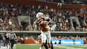 Texas Longhorns wide receiver Emmett Mosley V reaches for a pass during the first half against the Texas A&M Aggies