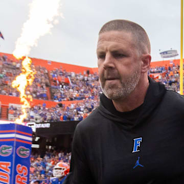 Florida Gators head coach Billy Napier runs onto the field before the start of the game at Ben Hill Griffin Stadium in Gainesville, FL on Saturday, September 7, 2024 against the Samford Bulldogs. The Gators won 45-7. [Doug Engle/Gainesville Sun]