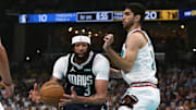 Dallas Mavericks forward Anthony Davis drives to the basket against Memphis Grizzlies forward Santi Aldama.