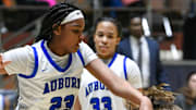 Prattville's Grace Downey (12) grabs a rebound from Auburn's Kelsi Andrews (23) during AHSAA Regional Basketball Tournament action at Garrett Coliseum in Montgomery, Ala., on Wednesday February 16, 2022.

Pratt01