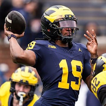 Team Blue quarterback Bryce Underwood (19) makes a pass against Team Maize during the second half of the spring game at Michigan Stadium in Ann Arbor on Saturday, April 19, 2025.