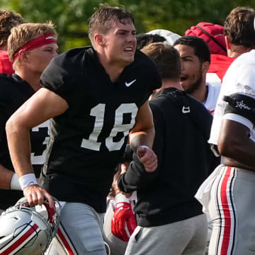 Aug 8, 2024; Columbus, Ohio, USA; Ohio State Buckeyes quarterback Will Howard (18) runs during football practice at the Woody Hayes Athletic Complex.