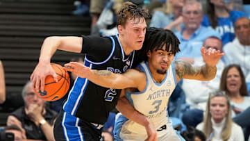 Duke Blue Devils forward Cooper Flagg (2) with the ball as North Carolina Tar Heels guard Elliot Cadeau (3)