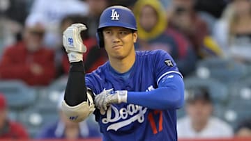 Los Angeles Dodgers designated hitter Shohei Ohtani (17) adjusts his elbow pad during his at bat at Angel Stadium on March 25.