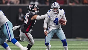 Nov 3, 2024; Atlanta, Georgia, USA; Dallas Cowboys quarterback Dak Prescott (4) is tackled from behind by Atlanta Falcons linebacker Kaden Elliss (55) during the second half at Mercedes-Benz Stadium. Mandatory Credit: Dale Zanine-Imagn Images