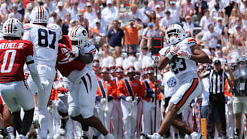 Sep 13, 2025; Auburn, Alabama, USA;  Auburn Tigers cornerback Jay Crawford (23) scores a touchdown during the second quarter against the South Alabama Jaguars at Jordan-Hare Stadium. Mandatory Credit: John Reed-Imagn Images
