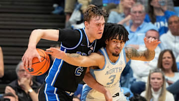Mar 8, 2025; Chapel Hill, North Carolina, USA;  Duke basketball forward Cooper Flagg (2) with the ball as UNC basketball guard Elliot Cadeau (3) defends in the second half at Dean E. Smith Center.