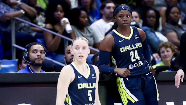 May 16, 2025; Arlington, Texas, USA; Dallas Wings guard Paige Bueckers (5) and Dallas Wings guard Arike Ogunbowale (24) and Dallas Wings head coach Chris Koclanes talk against the Minnesota Lynx during the first half at College Park Center. Mandatory Credit: Kevin Jairaj-Imagn Images May 16, 2025; Arlington, Texas, USA; Dallas Wings guard Paige Bueckers (5) and Dallas Wings guard Arike Ogunbowale (24) and Dallas Wings head coach Chris Koclanes talk against the Minnesota Lynx during the first half at College Park Center. Mandatory Credit: Kevin Jairaj-Imagn Images