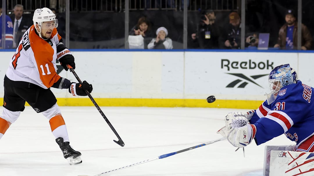 Dec 20, 2025; New York, New York, USA; Philadelphia Flyers right wing Travis Konecny (11) misses his shot against New York Rangers goaltender Igor Shesterkin (31) during the shootout at Madison Square Garden. Mandatory Credit: Brad Penner-Imagn Images