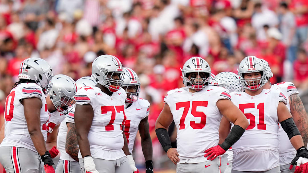 Ohio State Buckeyes offensive linemen Tegra Tshabola (77), Carson Hinzman (75) and Luke Montgomery (51) wait for the ball to be put in play in the second half at Camp Randall Stadium on Saturday, Oct. 18, 2025 in Madison, Wisconsin.