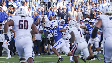 Oct 12, 2024; Provo, Utah, USA; Brigham Young Cougars linebacker Isaiah Glasker (16) runs an interception back for a touchdown against the Arizona Wildcats during the fourth quarter at LaVell Edwards Stadium. Mandatory Credit: Rob Gray-Imagn Images
