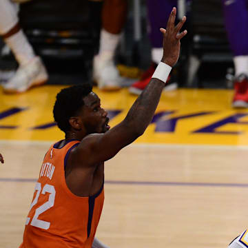 May 30, 2021; Los Angeles, California, USA; Los Angeles Lakers forward LeBron James (23) shoots against Phoenix Suns center Deandre Ayton (22) during the second half in game four of the first round of the 2021 NBA Playoffs. at Staples Center. Mandatory Credit: Gary A. Vasquez-Imagn Images